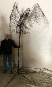 Eagle - The eagle is about 5 feet 4  inches high and 4 feet wide.  With the stand, the overall height is a little over 8 feet.