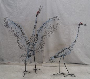 Cranes - wings out is 5 feet 5 inches high -wings down is 4 feet 7 inches high.